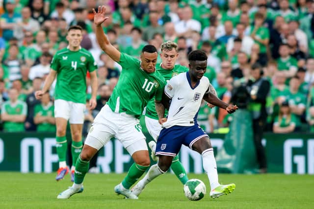 Celtic and Republic of Ireland striker Adam Idah vies for the ball with England's Bukayo Saka during the UEFA Nations League match in Dublin. (Photo by PAUL FAITH/AFP via Getty Images)