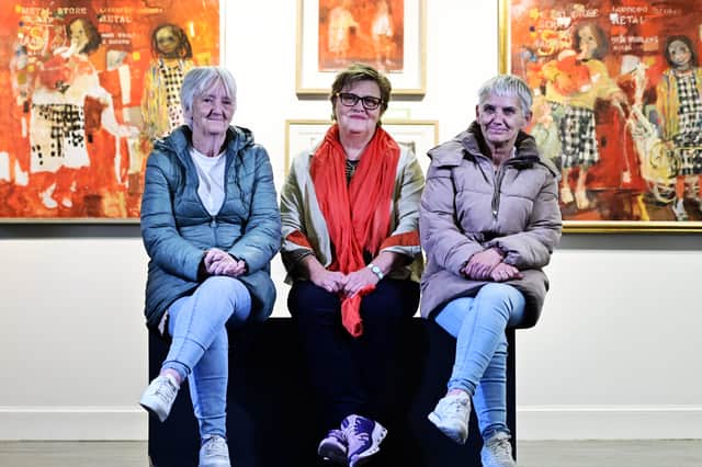 Sisters Pat (left) and Ann Samson (right) with artist Kate Downie who completed Joan Eardley's unfinished painting of them, called Two Children