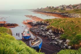 Small fishing boats on a foggy morning in Berneray, North Uist, where Fish has made his home. Picture: Getty Images