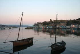Skiffs moored at Tarbert in Kintyre where Norwegian King Magnus Olafsson visited in 1098. 