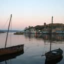 Skiffs moored at Tarbert in Kintyre where Norwegian King Magnus Olafsson visited in 1098. 