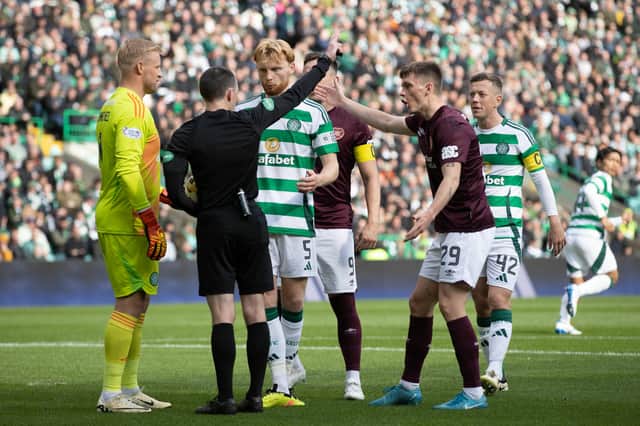 Liam Scales appeals the decision to award a penalty against him against Hearts before VAR ruled the penalty out.