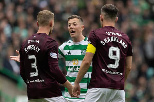 Stephen Kingsley and Lawrence Shankland discuss a decision with Celtic captain Callum McGregor.