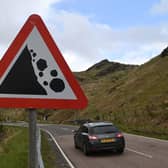 A falling rocks sign on the A83 near the Rest and Be Thankful