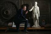 Historic Environment Scotland collections registrar Ross Irving with the statue of Robert Burns