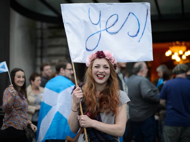 A young independence supporter waves a Yes flag ahead of the 2014 referendum on Scottish independence (Picture: Leon Neal)