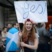 A young independence supporter waves a Yes flag ahead of the 2014 referendum on Scottish independence (Picture: Leon Neal)
