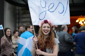 A young independence supporter waves a Yes flag ahead of the 2014 referendum on Scottish independence (Picture: Leon Neal)