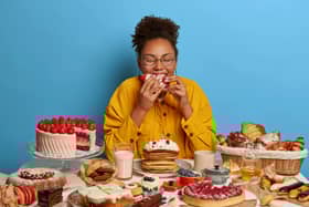 Woman eating cakes