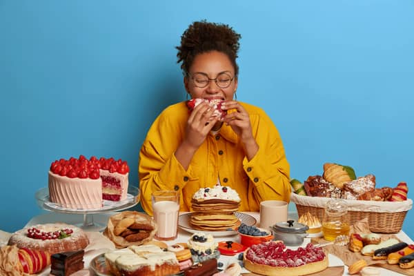Woman eating cakes
