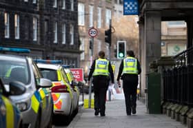 Police officers outside the Police Scotland Leith station in Edinburgh