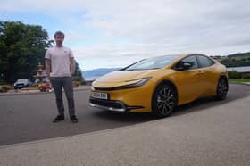 Scotsman writer Steven Chisholm with the 2024 Toyota Prius ahead of a test drive near Loch Lomond. Credit Steven Chisholm