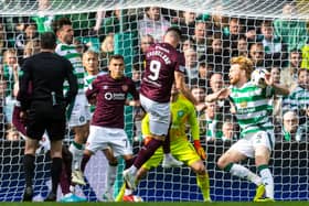 Referee Colin Steven awarded a penalty to Hearts for this handball by Celtic defender Liam Scales, but overturned his decision following a VAR intervention. (Photo by Ross MacDonald / SNS Group)