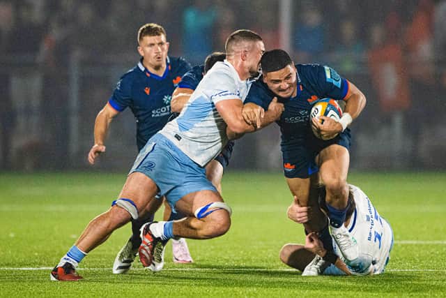 Mosese Tuipulotu is kept quiet by the Leinster defence.