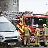 Firefighters attend the incident at the former luxury hotel. Picture: Michael Gillen