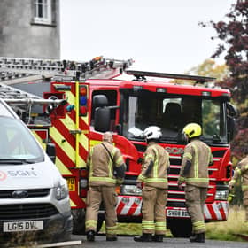 Firefighters attend the incident at the former luxury hotel. Picture: Michael Gillen