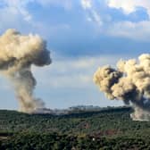 Plumes of smoke rise from the sites of Israeli airstrikes near the southern Lebanese village of Zibqin (Picture: Kawnat Haju)