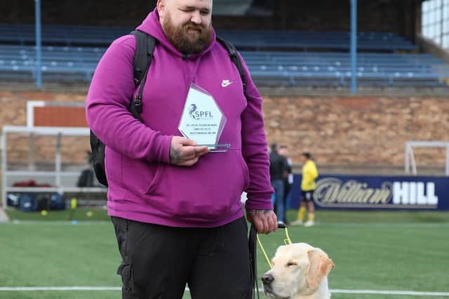 Jon Attenborough and his Labrador Sam at Station Park, Forfar. Picture: SPFL/Christopher Coutts/SWNS
