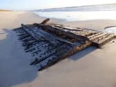 The remains of the ship's wooden hull were exposed on an Orkney beach by a storm earlier this year
