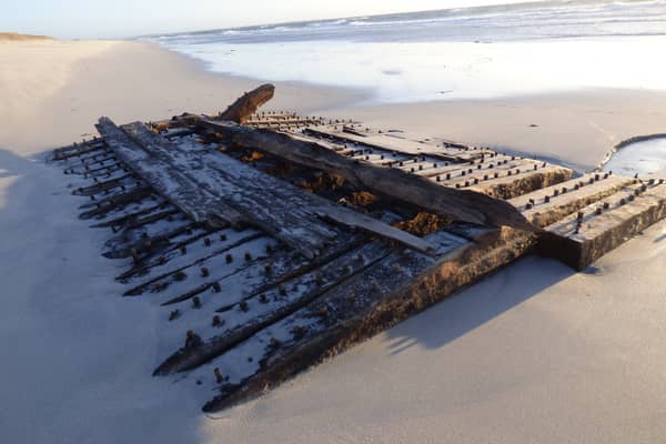 The remains of the ship's wooden hull were exposed on an Orkney beach by a storm earlier this year