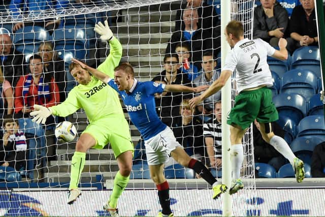 David Gray heads home during a victory over Rangers in 2014.