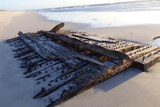 The remains of the ship's wooden hull were exposed on an Orkney beach by a storm earlier this year
