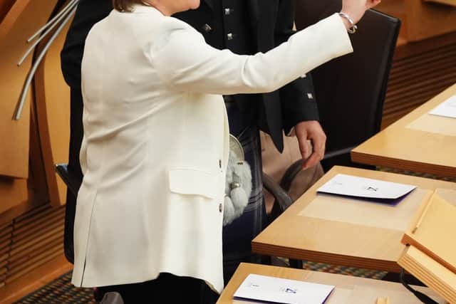Former first ministers Nicola Sturgeon and Humza Yousaf take a selfie before the ceremony.