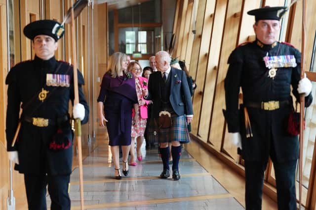 Presiding Officer Alison Johnstone leads King Charles III into the Scottish Parliament chamber.