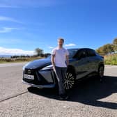 Steven Chisholm poses with the Lexus RZ300e test car near Glen Fruin