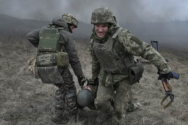 Ukrainian servicemen perform a medical evacuation during a field military exercise in the Donetsk region earlier this year (Picture: Genya Savilov)