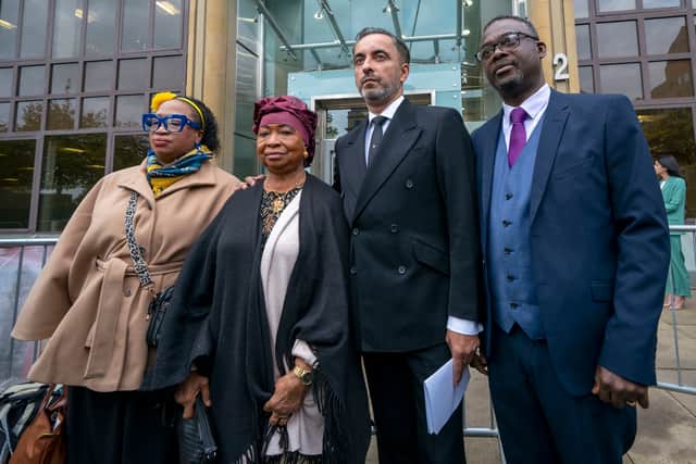 Solicitor Aamer Anwar (second right) alongside Skehu Bayoh's sister Kosna Bayoh (left) and mother Aminata Bayoh (second left) outside Capital House, Edinburgh.