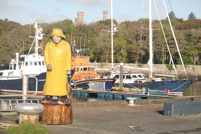 A statue of the Stornoway Fisherman, at the town's harbour.