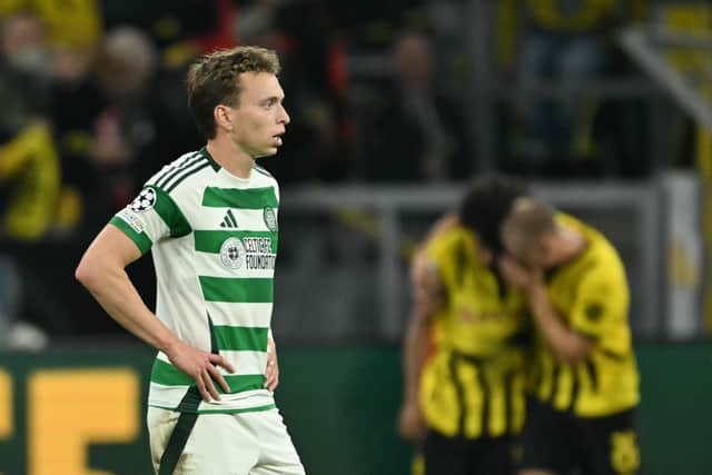 Celtic defender Alistair Johnston looks on in horror during the 7-1 defeat by Dortmund.