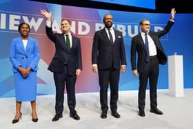 From left, Tory leadership candidates Kemi Badenoch, Robert Jenrick, James Cleverly and Tom Tugendhat stand together on stage after delivering their speeches during the Conservative Party Conference at the International Convention Centre in Birmingham