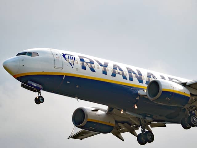 A woman was charged after a disturbance on a flight arriving at Edinburgh Airport on Tuesday morning.