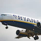 A woman was charged after a disturbance on a flight arriving at Edinburgh Airport on Tuesday morning.