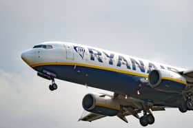 A woman was charged after a disturbance on a flight arriving at Edinburgh Airport on Tuesday morning.
