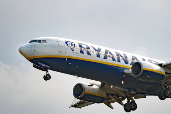 A woman was charged after a disturbance on a flight arriving at Edinburgh Airport on Tuesday morning.