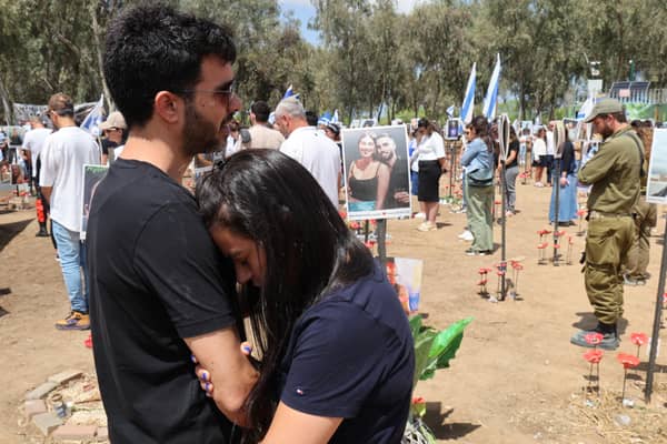 A two-minute silence is held at the site of the Supernova music festival where many young people were killed or taken hostage by Palestinian militants on October 7 last year (Picture: Jack Guez)