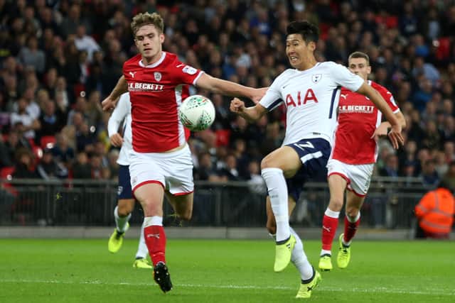 Barnsley's Liam Lindsay challenges Tottenham star Son Heung-Min during an English League Cup third round match at Wembley in September 2017. (Photo - LEE MILLS/AFP via Getty Images)