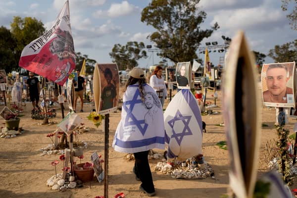 Peopls visit the site of the Nova music festival, where hundreds of revelers were killed and abducted by Hamas, on the eve of the one-year anniversary of the attack, near Kibbutz Reim, southern Israel