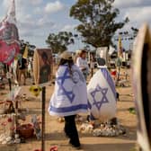 Peopls visit the site of the Nova music festival, where hundreds of revelers were killed and abducted by Hamas, on the eve of the one-year anniversary of the attack, near Kibbutz Reim, southern Israel
