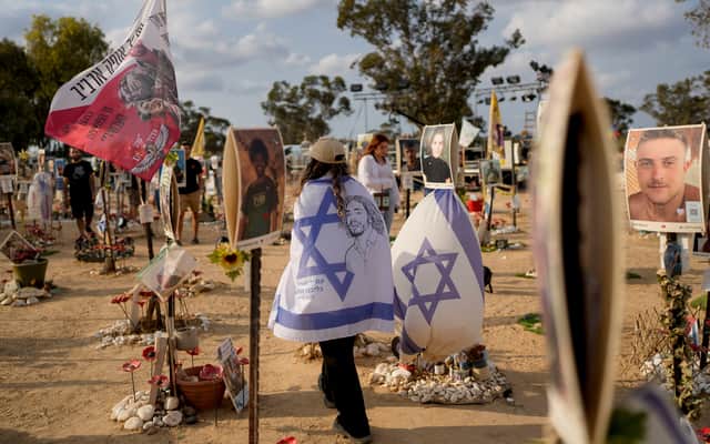 Peopls visit the site of the Nova music festival, where hundreds of revelers were killed and abducted by Hamas, on the eve of the one-year anniversary of the attack, near Kibbutz Reim, southern Israel