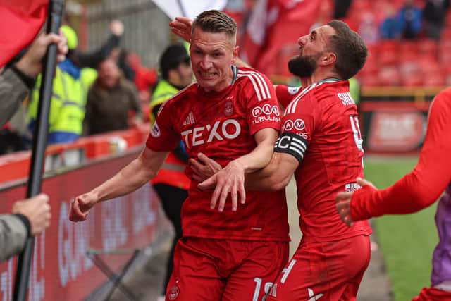 Aberdeen celebrate their winner.