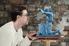 Artist David J Mitchell with a maquette of his 'Figure of Destiny' statue. Picture: John Devlin 