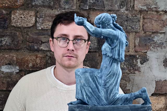 Artist David J Mitchell with a maquette of his 'Figure of Destiny' sculpture. Picture: John Devlin 