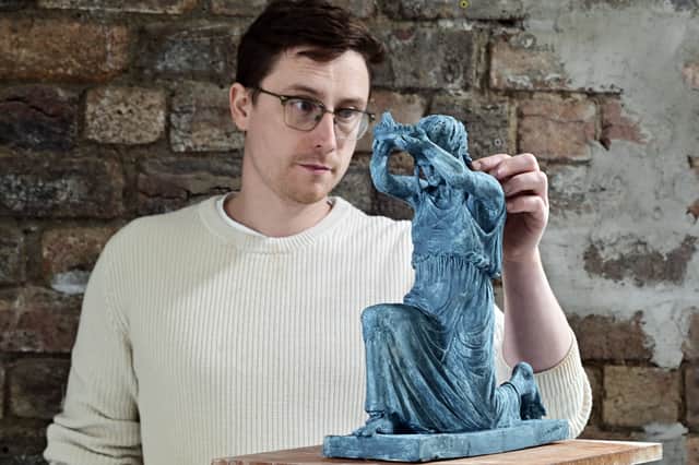 Artist David J Mitchell with a maquette of his 'Figure of Destiny' sculpture. Picture: John Devlin 