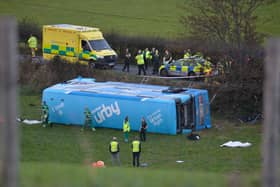 Emergency workers at the scene of a  school bus crash on the Ballyblack Road East near Carrowdore in Northern Ireland on Monday afternoon.