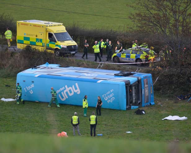 Emergency workers at the scene of a  school bus crash on the Ballyblack Road East near Carrowdore in Northern Ireland on Monday afternoon.