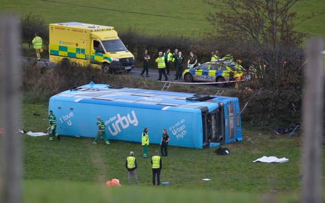Emergency workers at the scene of a school bus crash on the Ballyblack Road East near Carrowdore in Northern Ireland on Monday afternoon.